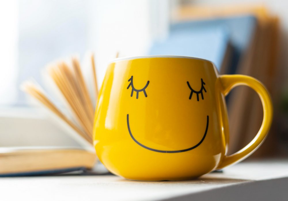 open-book-smiley-yellow-cup